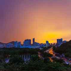 海南三亚城市雨明亮的橙色天空