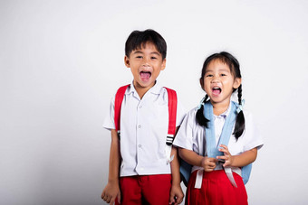 亚洲学生孩子女孩男孩小学生哥哥妹妹微笑快乐穿学生泰国统一的红色的裤子裙子