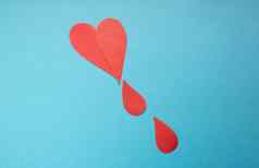 概念世界血捐赠血友病一天红色的纸滴血蓝色的背景