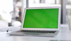 使着陆页面使最大声明拍摄移动PC绿色屏幕桌子上现代办公室