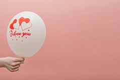 情人节卡的地方文本气球登记爱孩子的手粉红色的背景