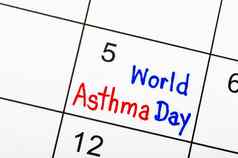 假期世界哮喘一天月手写作桌子上日历