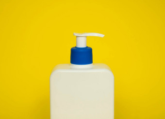 白色塑料肥皂洗发水自动售货机泵瓶孤立的蓝色的背景皮肤护理乳液洗澡至关重要的产品洗发水瓶浴身体乳液细液体手洗