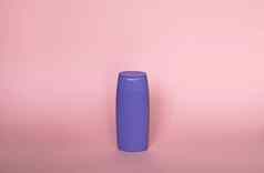 紫罗兰色的塑料瓶身体护理美产品工作室摄影塑料瓶洗发水淋浴过来这里噪音孤立的粉红色的背景