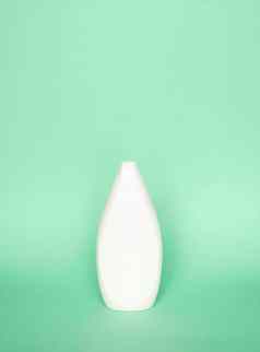 白色塑料洗发水瓶孤立的绿色背景皮肤护理乳液洗澡至关重要的产品洗发水瓶浴身体乳液细液体手洗
