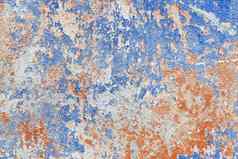 蓝色的红色的脏破旧的油漆表面混凝土墙纹理摘要背景模式