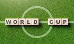 世界杯词字母木块多维数据集足球场中心行体育运动比赛概念插图呈现