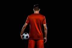 少年足球球员男孩足球运动服装游戏球体育运动概念