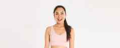 体育运动幸福活跃的生活方式概念快乐微笑亚洲女运动员运动胸罩逗乐快乐的左发现伟大的锻炼程序站白色背景