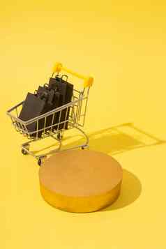 模型讲台上基座微型超市车购物袋黑色的星期五出售黄色的