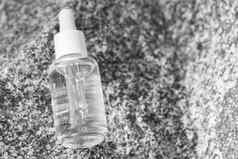 血清玻璃透明的瓶吸管石头表面自然有机水疗中心化妆品概念