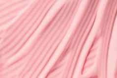 奶油粉红色的护肤品乳液摩丝产品特写镜头桃子奶油保湿霜传播防晒霜化妆品涂片背景保湿美噪音乳香斯沃琪粉红色的油漆酸奶纹理