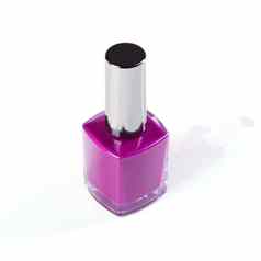 添加紫色的美工作室拍摄色彩斑斓的指甲清漆瓶