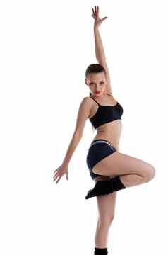 运动年轻的女人摆姿势跳舞体育运动服装