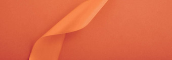 摘要卷曲的丝绸丝带橙色背景独家奢侈品品牌设计假期出售产品促销活动魅力艺术邀请卡背景