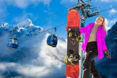 回来视图女滑雪站滑雪板手享受高山山景观滑雪概念
