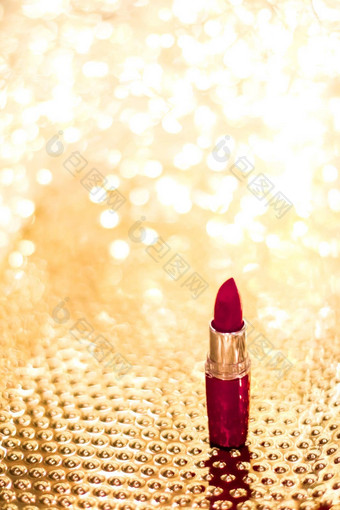 黑暗红色的口红金圣诞节年情人节一天假期闪闪发光的背景化妆化妆品产品奢侈品美品牌