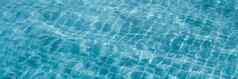 摘要背景模式扯掉水表面游泳池光反射充满活力的蓝色的绿色