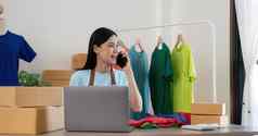 美丽的亚洲女人在线卖方确认订单客户电话开始小企业锻造主人女企业家移动PC首页包交付情况概念