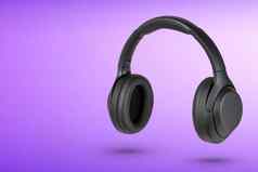 耳机紫色的背景无线耳机黑色的高质量广告产品目录