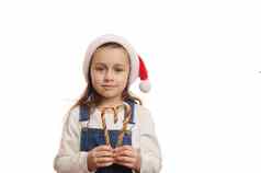 可爱的蓝眼睛的女孩圣诞老人他持有糖果拐杖形状心复制空间圣诞节广告