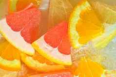 片葡萄柚橙色葡萄柚水白色背景块葡萄柚橙色水果蜂蜜葡萄柚液体泡沫片葡萄柚橙色水果蜂蜜葡萄柚水宏图像水果水水平图像前视图平设计