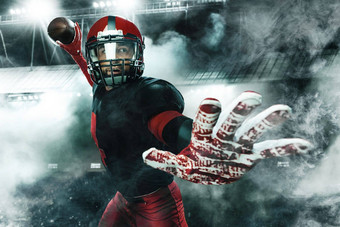 美国足球球员运动员运动员红色的头盔大竞技场背景体育运动动机壁纸