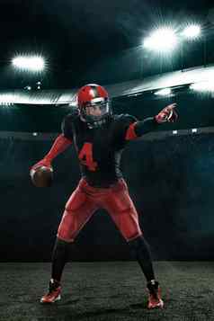 美国足球球员行动运动员运动员红色的头盔体育场背景体育运动动机壁纸