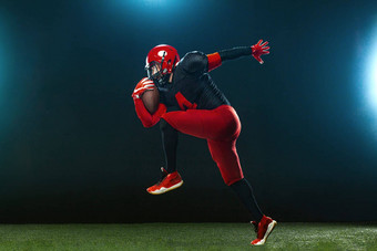 美国足球球员运动员运动员红色的头盔黑暗背景烟体育运动动机壁纸