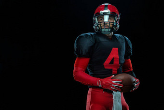 美<strong>国足</strong>球球员运动员运动员<strong>红</strong>色的头盔黑色的背景体育运动动机壁纸