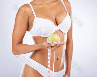 苹果健康身体女人健身饮食测量磁带<strong>减肥</strong>法排毒水果白色工作室背景纤维健康的生活方式皮肤胃内衣