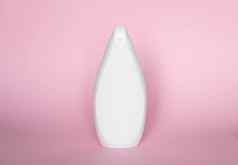 白色液体容器过来这里乳液奶油洗发水化妆品塑料瓶粉红色的背景化妆品包装模型复制空间