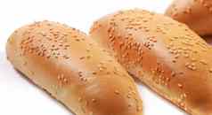 面包筷子芝麻种子孤立的白色背景白色乡村面包店食物概念工业烘焙面包使白色面粉新鲜有机烤面包