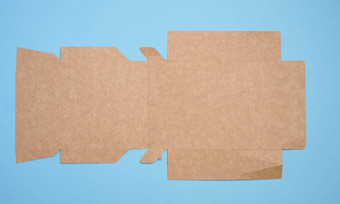 棕色（的）纸板盒子<strong>展开</strong>状态蓝色的背景食物<strong>包装</strong>商品前视图