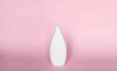 白色瓶液体肥皂洗发水过来这里粉红色的背景
