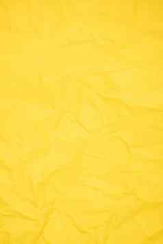 垂直黄色的颜色有皱纹的纸纹理背景