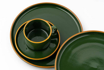 集黑暗绿色<strong>陶瓷餐具</strong>橙色概述了白色背景