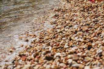 <strong>海波</strong>美丽的海滩鹅卵石纹理背景海滩白色黄色的灰色的石头温柔的圆形的卵石海滩<strong>海波</strong>