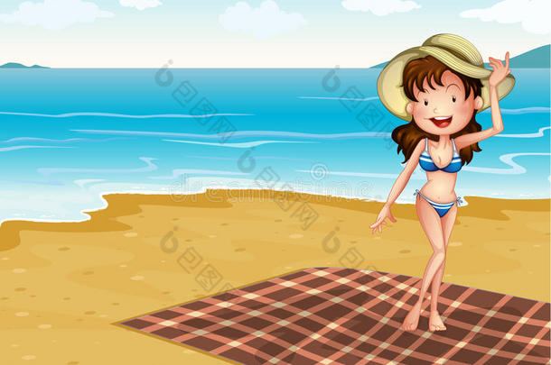 海滩上一个拿着毯子的女孩