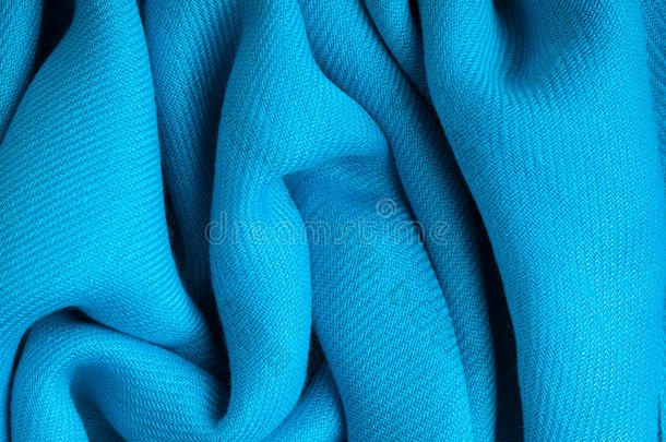 蓝色背景抽象布料织物纹理的波浪状褶皱