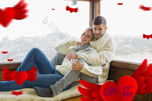 夫妇在<strong>冬季服装</strong>坐在机舱窗户上的复合图像