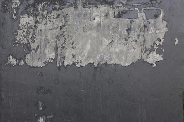 水泥砂浆墙面纹理与黑色油漆