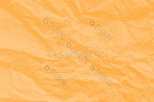 艺术纸的纹理。 独特的皱缩软橙色的纸页背景
