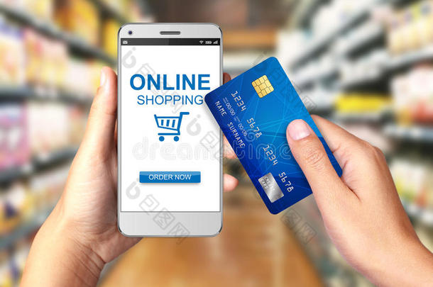 手持智能手机与网上购物显示，网上购物的概念