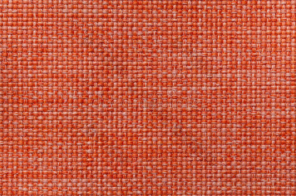 明亮的橙色纺织品背景与格子图案，特写。 织物宏观结构。