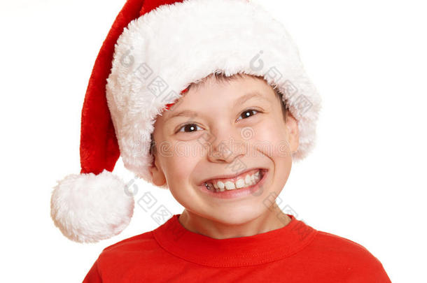 男孩儿童肖像在圣诞老人帽子，有乐趣和情感，寒假概念
