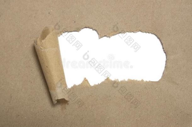 撕棕色的包装包金箔的在上面曲线和曲率纸和空白的白色的copysp