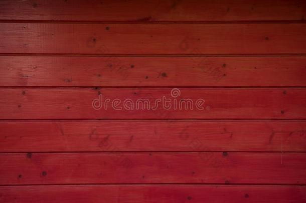 黑暗的红色的木制的墙同样地背景.红色的质地.木制的红色的fencing栅栏
