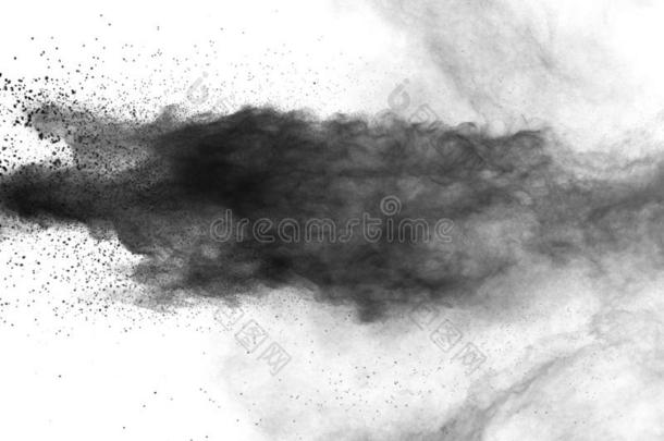 黑的粉爆炸向白色的背景.黑的灰尘微粒