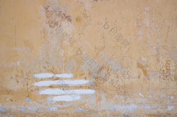 光黄色的粗糙的粉饰灰泥背景墙质地